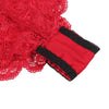 Close-up of red lace fabric with black trim on a white background