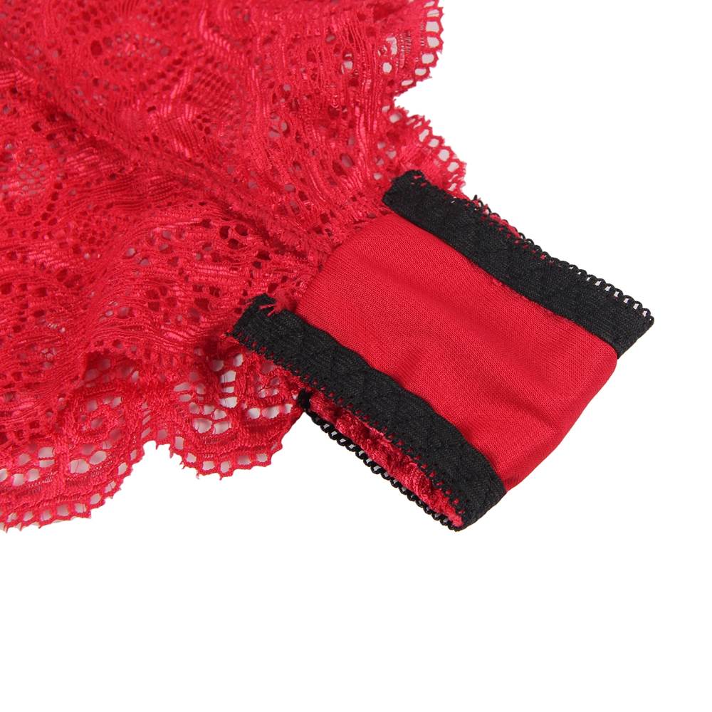 Close-up of red lace fabric with black trim on a white background