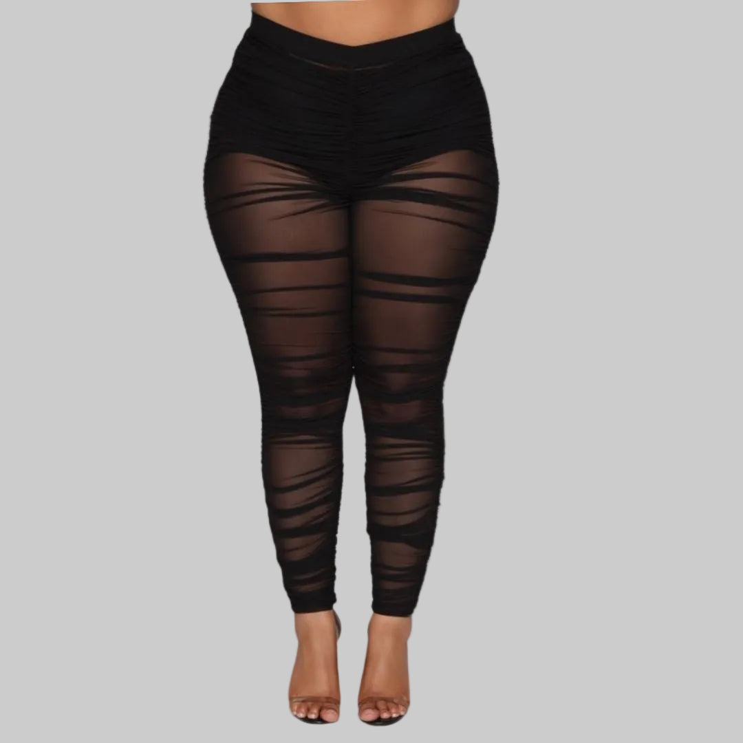 Black sheer leggings on a white background