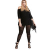 Woman wearing a black outfit with Black Sheer Mesh Ruched Leggings on a white background
