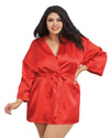 Woman wearing a red satin robe on a white background