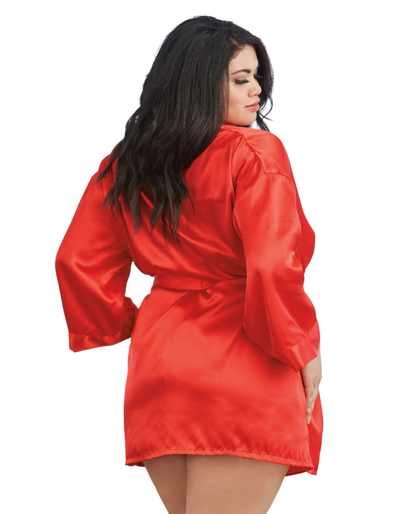 Woman wearing a red satin robe on a white background