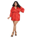 Woman wearing a red satin robe on a white background
