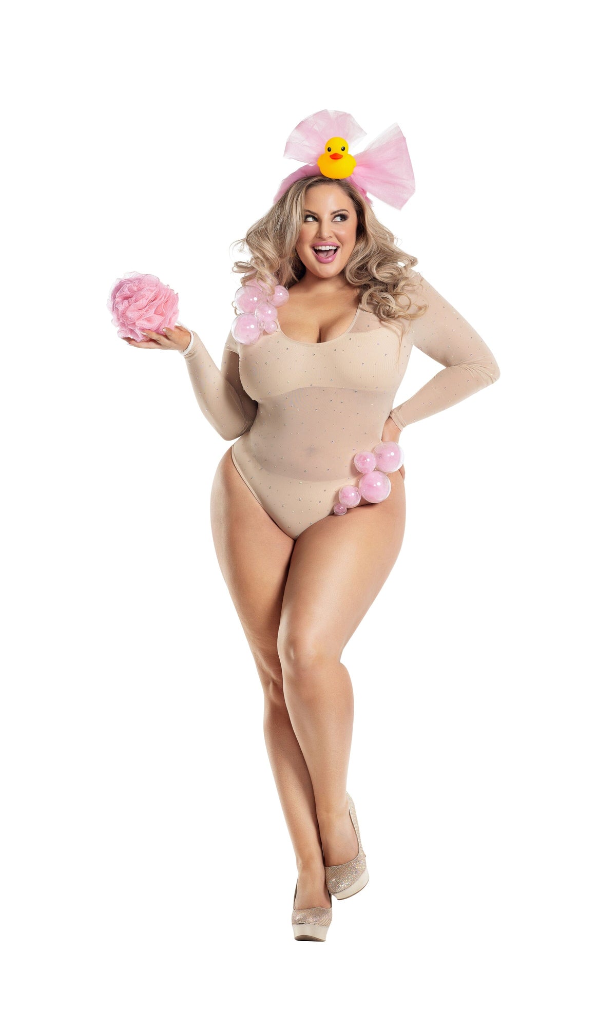 A plus-size woman modeling a beige long-sleeve bodysuit with pink balloon-like accessories, a pink bow headband with a yellow duck, and nude heels, posed against a plain white background.