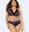 Woman wearing a black patterned bikini set on a white background