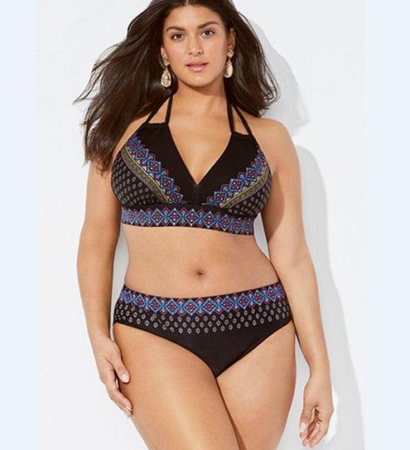 Woman wearing a black patterned bikini set on a white background