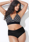 Woman wearing a black and white striped bikini against a white background